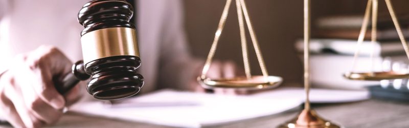 gavel-on-wooden-table-and-lawyer-or-judge-working-2025-01-09-05-29-20-utc
